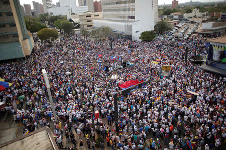 Supporters of Venezuelan opposition leader Juan Guaido, who many nations have recognised as the country's rightful interim ruler, take part in a rally during his visit in Maracaibo, Venezuela, April 13, 2019. REUTERS/Ueslei Marcelino