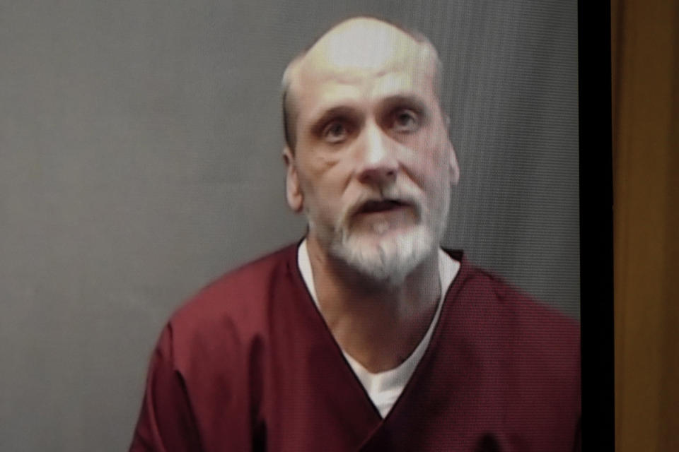 FILE - In this photo from a video screen, death row inmate James Coddington speaks to the Oklahoma Board of Pardon and Parole on Wednesday, Aug. 3, 2022, in Oklahoma City. Oklahoma Gov. Kevin Stitt has rejected clemency for Coddington, who is facing execution for the 1997 hammer killing of a man. Stitt’s decision on Wednesday, Aug. 24, 2022, paves the way for Coddington to be executed by lethal injection on Thursday. (AP Photo/Sue Ogrocki, File)