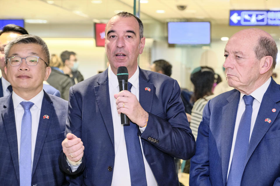 In this photo released by the Taiwan Ministry of Foreign Affairs, Eric Bothorel, center, leader of a French National Assembly delegation visiting Taiwan, speaks upon arriving at the Taoyuan International Airport in Taiwan on Monday, April 17, 2023. (Taiwan Ministry of Foreign Affairs via AP)