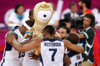 The United States players celebrate winning the Men's Basketball gold medal game between the United States and Spain. The U.S. won the match 107-100. (Getty Images)