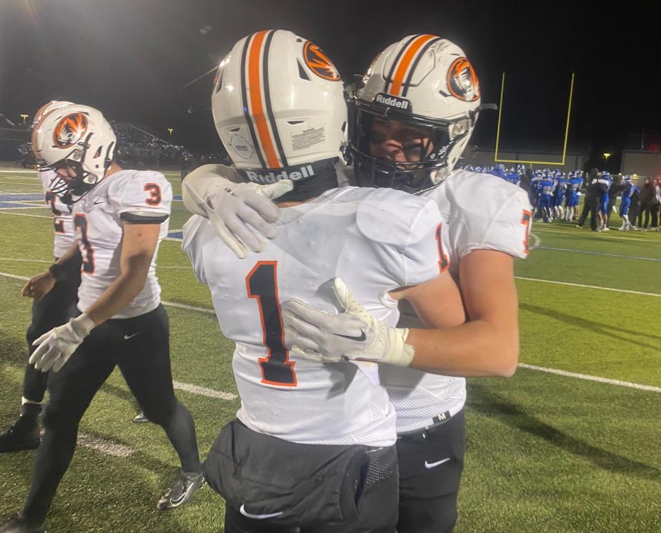 Republic seniors Gunner Ellison (1) and Gavyn Becker (7) embrace after falling to Carthage 28-14 in Friday's Class 5 District 6 championship game in Carthage.