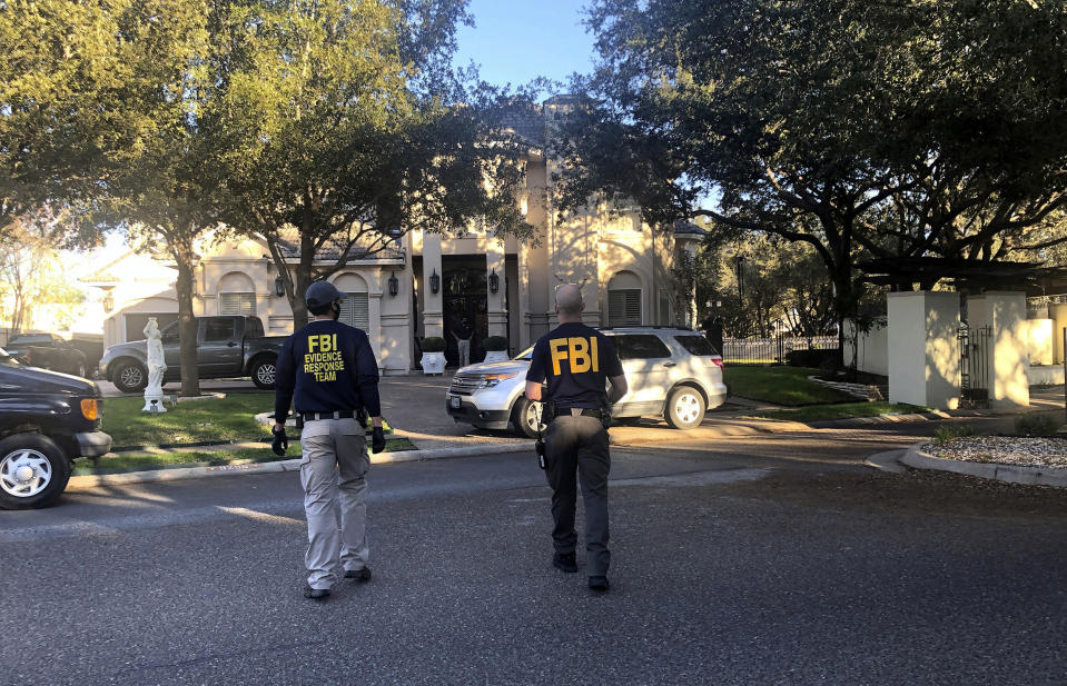 Image: Federal agents search the home of U.S. Rep. Henry Cuellar in Laredo, Texas, on Jan. 19, 2022. (Valerie Gonzalez / The Monitor via AP)
