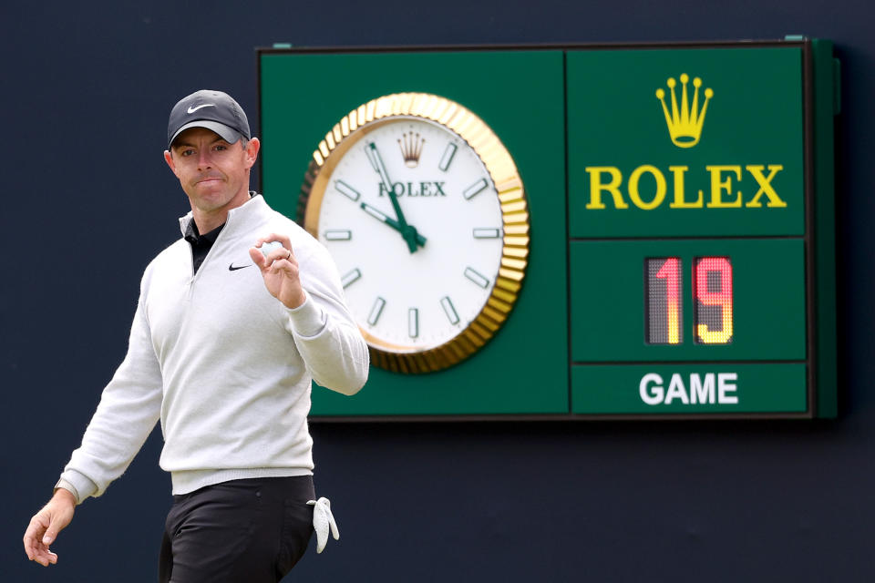 Rory McIlroy waves to the crowd on the first tee