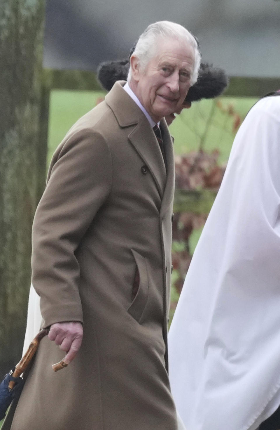 Britain's King Charles III and Queen Camilla arrive to attend a Sunday church service at St Mary Magdalene Church, in Sandringham, Norfolk, England, Sunday, Feb. 11, 2024. (PA via AP)