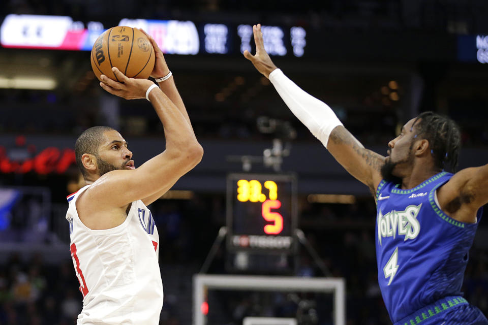 Los Angeles Clippers forward Nicolas Batum (33) shoots against Minnesota Timberwolves guard Jaylen Nowell (4) during the first half of an NBA basketball game Friday, Nov. 5, 2021, in Minneapolis. (AP Photo/Andy Clayton-King)