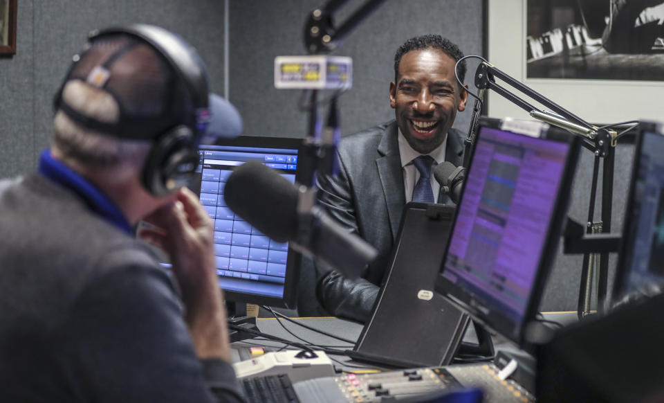 Andre Dickens, right, is interviewed by Scott Slade, left, on WSB Radio on Wednesday, Nov. 3, 2021 in Atlanta. Atlanta City Council President Felicia Moore emerged Tuesday as the clear leader in the mayor's race in Georgia's largest city, advancing to a Nov. 30 runoff with about 40% of the vote in the nonpartisan race. Moore's opponent remained unclear early Wednesday, as City Council member Andre Dickens sought to deny former Mayor Kasim Reed the second runoff spot. (John Spink/Atlanta Journal-Constitution via AP)