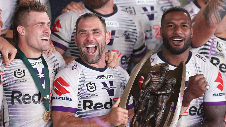 Pictured here, Storm captain Cam Smith celebrates with teammates after winning the 2020 NRL grand final.