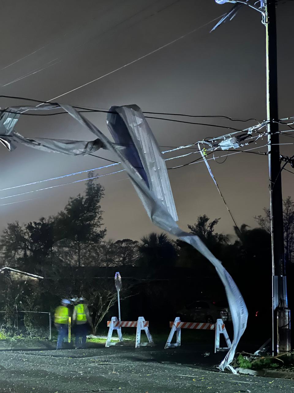 Metal is wrapped around power lines at 19th Street and Arthur Avenue in St. Andrews on Friday night.
