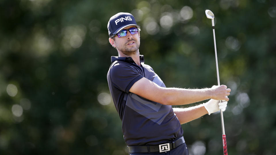 Scott Harrington watches his tee shot on the 9th hole during the third round of the Houston Open golf tournament Saturday, Oct, 12, 2019, in Houston. (AP Photo/Michael Wyke)