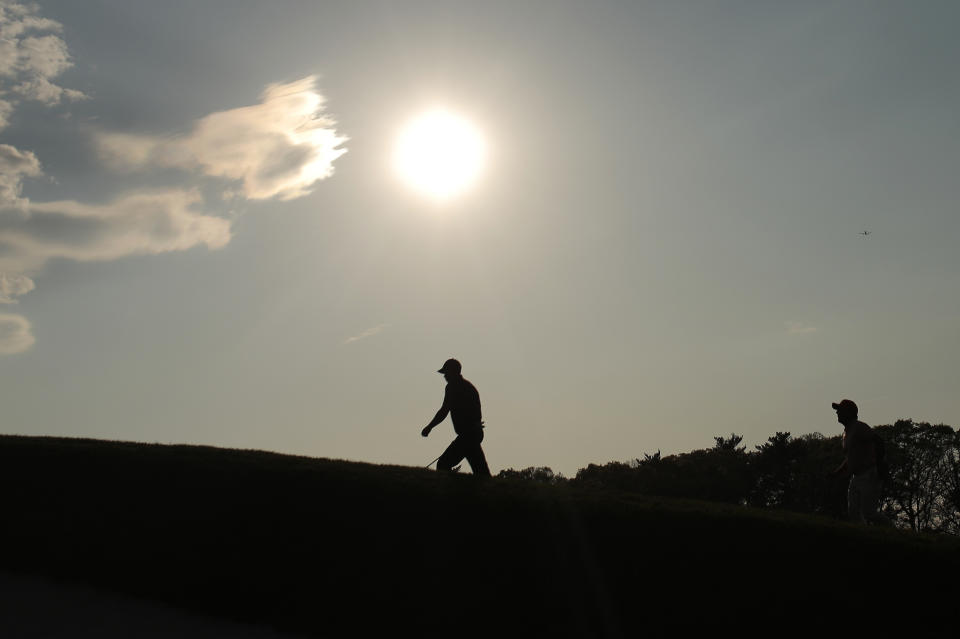 Tiger Woods walks up to the 18th green during the second round of the PGA Championship golf tournament, Friday, May 17, 2019, at Bethpage Black in Farmingdale, N.Y. (AP Photo/Andres Kudacki)