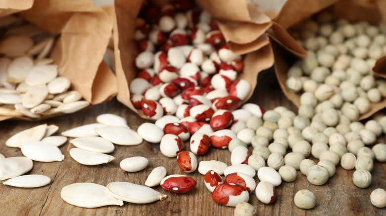 Beans spilling from paper bags