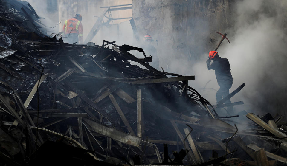 <p>Firefighters try to extinguish a fire of a building that caught fire and collapsed in the center of Sao Paulo, Brazil, May 2, 2018. (Photo: Nacho Doce/Reuters) </p>