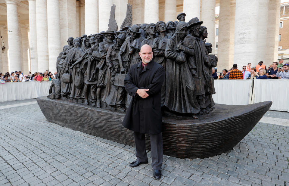 Sculptor Timothy P. Schmalz with his statue Sunday at the Vatican. (Photo: Remo Casilli / Reuters)