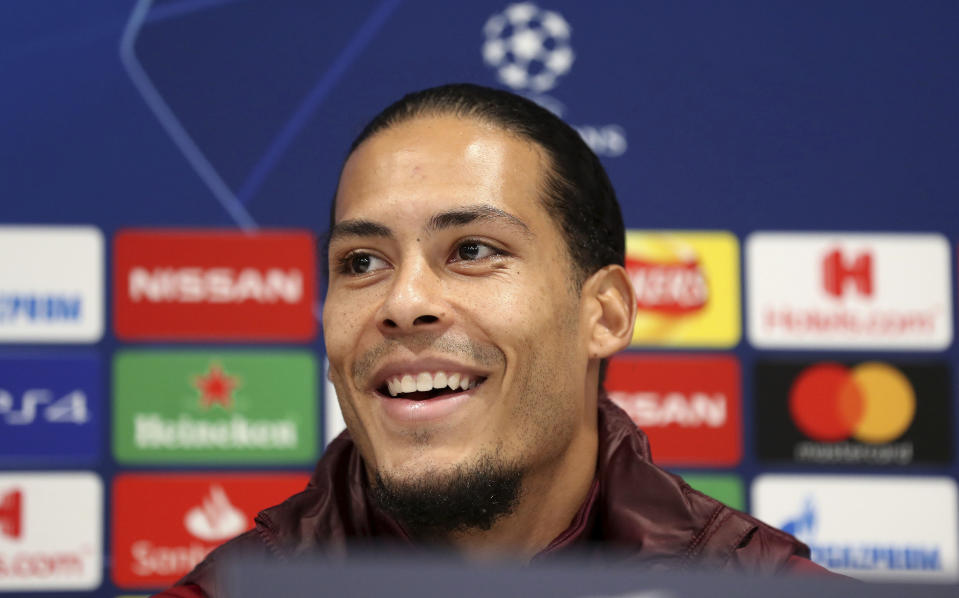 Liverpool's Virgil van Dijk smiles during a press conference at Anfield, in Liverpool, England, Monday, Dec. 10, 2018. Liverpool will play Napoli in a Champions League Group C soccer match on Tuesday. (Martin Rickett/PA via AP)