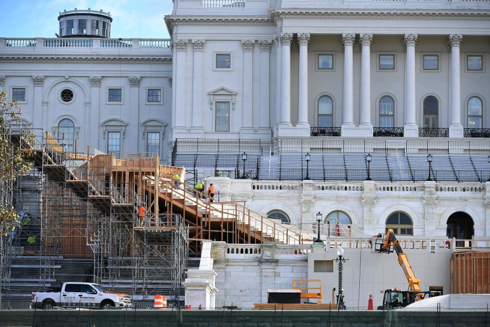 Workers construct the stage for the presidential inauguration at the U.S. Capitol in Washington, D.C., on December 1, 2020. / Credit: MANDEL NGAN/AFP via Getty Images