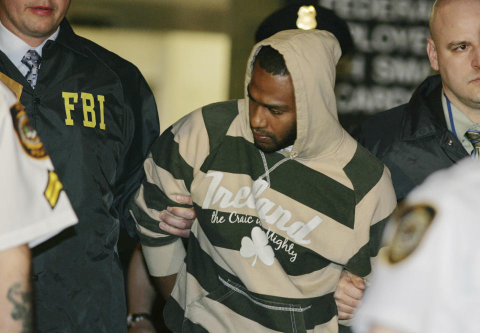 FILE - David Williams, center, is led by police officers from a federal building, May 21, 2009, in New York after being arrested on charges related to a bombing plot in The Bronx. Four men snared in an infamous post-9/11 terrorism sting were ordered freed from prison Thursday, July 27, 2023, with a judge finding that they had been "hapless, easily manipulated and penurious petty criminals" caught up in a plot driven by an overzealous FBI and a dodgy informant. (AP Photo/Robert Mecea, File)