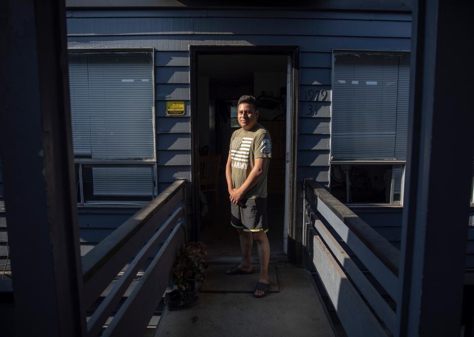 Rosendo Tzopitl stands outside his apartment on Hawthorne Ave. NE on Monday, Aug. 8, 2022, in Salem, Ore. Tzoptil and his roommates have dealt with water leaks, cockroaches, mold and other unsafe living conditions.