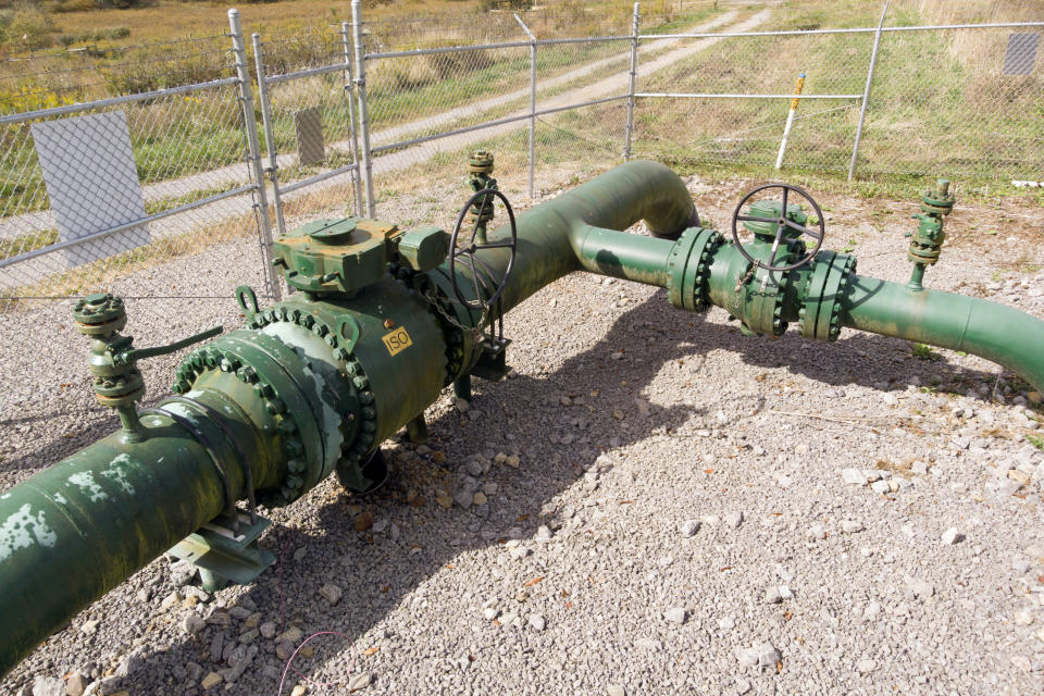 FILE - A MarkWest Liberty natural gas pipeline and fracking well cap is seen in Valencia, Pa., on Oct. 14, 2020. Amid pushback from industry and lawmakers in both parties, federal energy regulators on Thursday, March 24, 2022, scaled back plans to consider how natural gas projects affect climate change and environmental justice. (AP Photo/Ted Shaffrey, File)