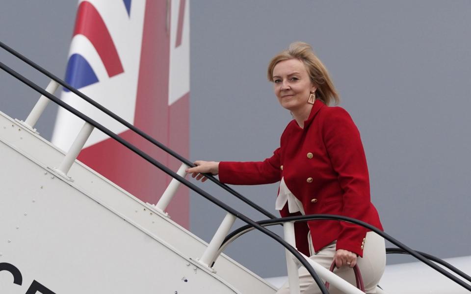 Liz Truss boarding RAF Voyager on her way to India for a two-day visit aimed at boosting trade links and combating climate change - Stefan Rousseau/PA Wire