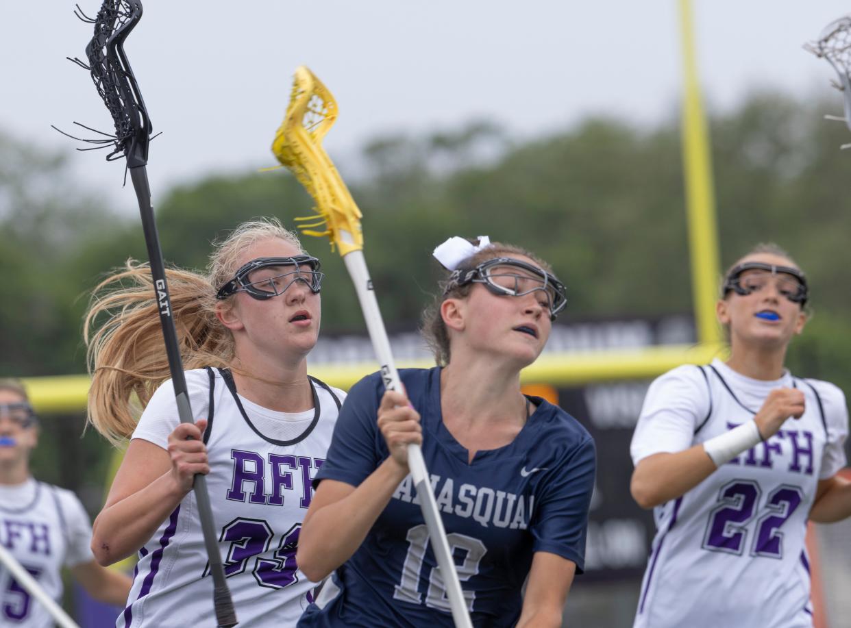 Manasquan's Julianna Farinacci (#12) outruns Rumson-Fair Haven's Jacquelin Braceland (#33) and Elliott Van Nice (#22). Manasquan Girls Lacrosse defeats Manasquan 13-8 in NJSIAA Sectional final in Rumson, NJ on June 1, 2022.