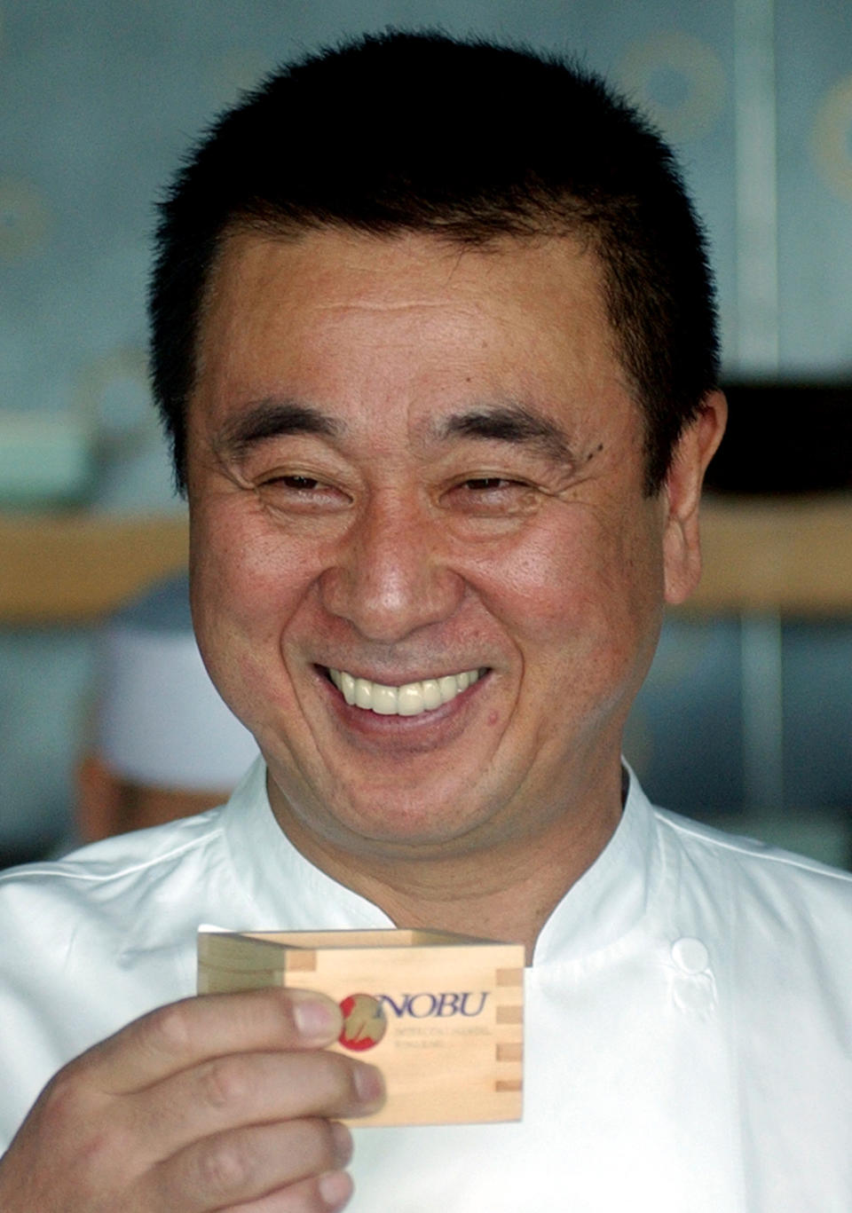 FILE - In this Jan. 10, 2007 file photo, celebrity Japanese chef Nobuyuki Matsuhisa smiles as he proposes a toast for his new restaurant Nobu, at a press availability in Hong Kong. Matsuhisa will be honored Saturday, Feb. 23, 2013, at the South Beach Wine and Food Festival for his fusion cuisine that blends Japanese and South American ingredients. (AP Photo/Lo Sai-hung, File)
