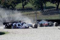AlphaTauri's French driver Pierre Gasly (L) crashes with Haas F1's French driver Romain Grosjean during the Tuscany Formula One Grand Prix at the Mugello circuit in Scarperia e San Piero on September 13, 2020. (Photo by Luca Bruno / POOL / AFP) (Photo by LUCA BRUNO/POOL/AFP via Getty Images)
