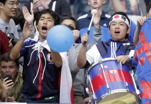 Japan's fans celebrate victory after the group D, London 2012 Olympic Games men's football match Japan vs Spain, at Hampden Park in Glasgow, Scotland, on July 26. Japan won 1-0