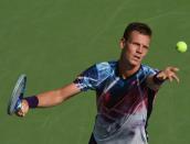 Tomas Berdych of the Czech Republic hits the ball against Bjorn Fratangelo of the US during their US Open men's singles match on September 1, 2015 in New York