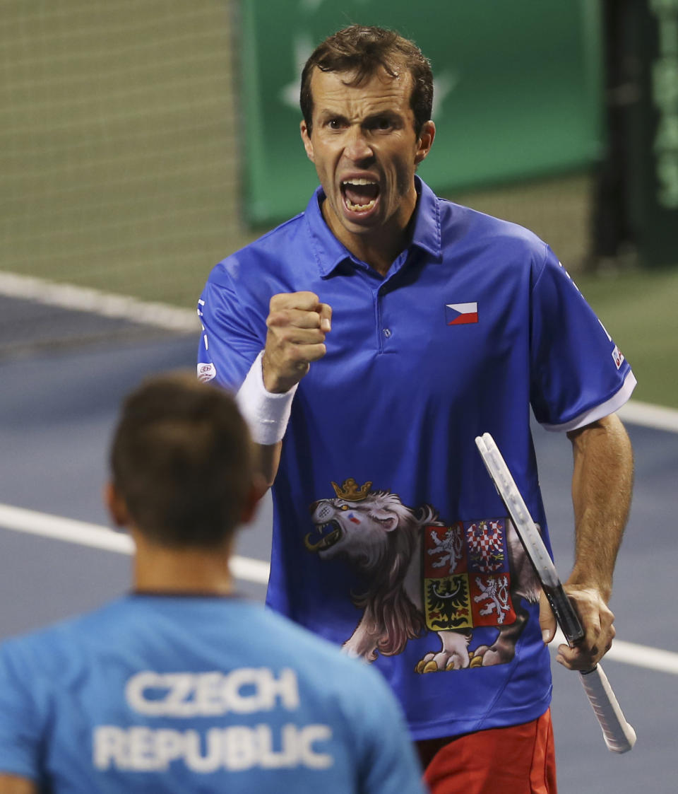 Radek Stepanek, facing camera, of Czech Republic celebrates with compatriot Lukas Rosol after getting a point during their quarterfinal of Davis Cup World Group tennis against Japan at Ariake Colosseum in Tokyo, Saturday, April 5, 2014. (AP Photo/Koji Sasahara)