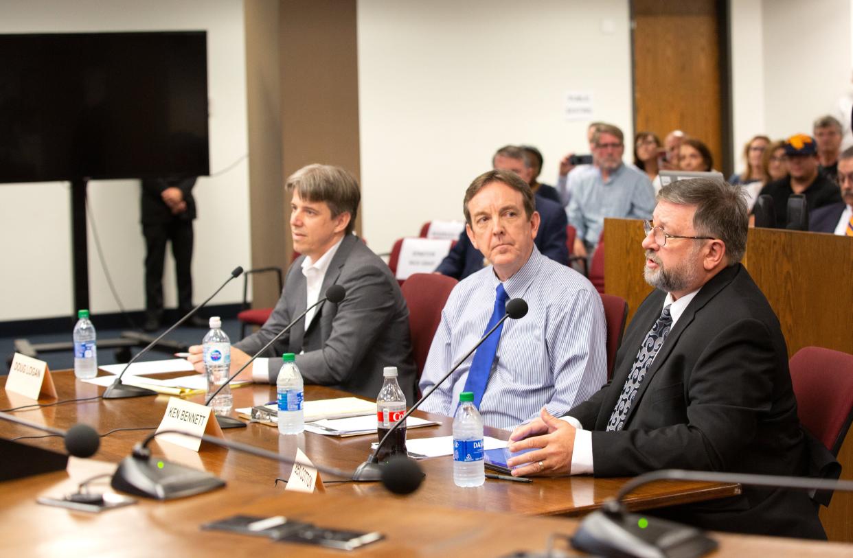 Cyber Ninjas CEO Doug Logan (from left), Arizona Senate's liaison for the Maricopa County election audit Ken Bennett, and CyFIR founder Ben Cotton are seen at the Arizona State Senate in Phoenix on July 15, 2021.