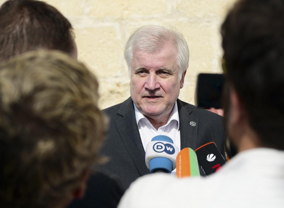 German Interior Minister Horst Seehofer speaks to the media at the end of an informal meeting of EU interior ministers, at Fort St. Angelo, in Birgu, Malta, Monday, Sept. 23, 2019. Five European Union nations have agreed to a temporary arrangement to take in migrants rescued from the central Mediterranean Sea. (AP Photo/Jonathan Borg)