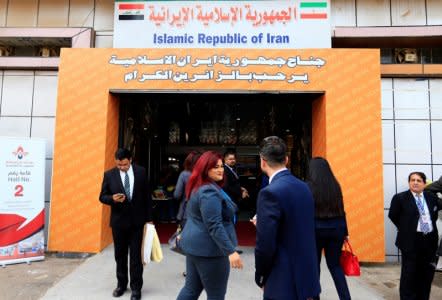 People walk in the entrance of the Iran section of the Baghdad International Fair, in Baghdad, Iraq November 10, 2018. REUTERS/Thaier al-Sudani