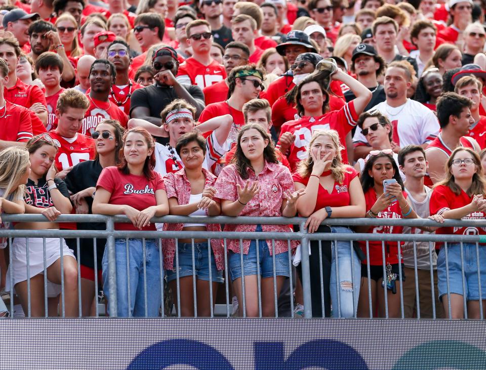 Ohio State students show their dejection following a touchdown by the Oregon Ducks during the second half of the NCAA football game at Ohio Stadium in Columbus on Saturday, Sept. 11, 2021. 