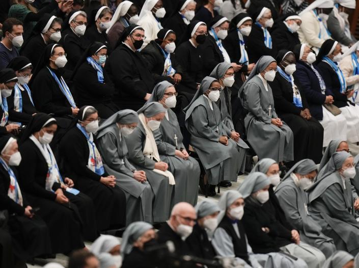FILE - Nuns wearing FFP2 masks listen to Pope Francis during his weekly general audience in the Paul VI Hall, at the Vatican, Wednesday, Jan. 5, 2022. Italy, Spain and other European countries are re-instating or stiffening mask mandates as their hospitals struggle with mounting numbers of COVID-19 patients. (AP Photo/Alessandra Tarantino, file )