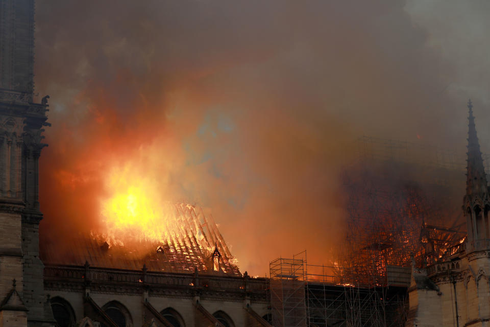 Flames and smoke are seen billowing from the roof at Notre-Dame Cathedral April 15, 2019 in Paris, France. (Photo: Pierre Suu/Getty Images)