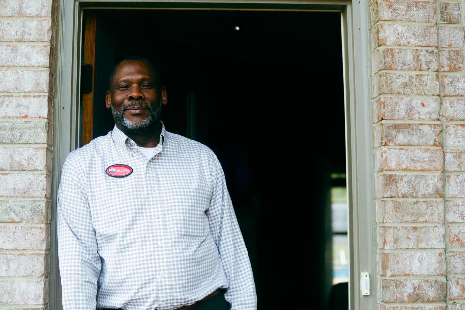 Realtor Jay McMiller poses for a portrait in front of a house he is looking to sell at 3758 Vintage Drive in Southaven on Sunday, April 7, 2024.