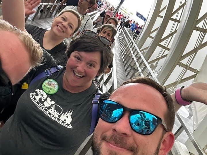 jennifer and her party in the fast lane at tron roller coaster in disney world