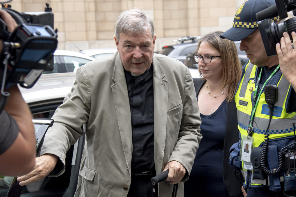 In this Feb. 26, 2019, photo, Cardinal George Pell leaves the County Court in Melbourne, Australia. Australia's highest court will deliver its ruling on April 7, 2020 on whether to overturn the convictions of Pell, the most senior Catholic convicted of child sex abuse. The 78-year-old Pell is one year into a six-year sentence for molesting two 13-year-old choirboys in Melbourne’s St. Patrick’s Cathedral while he was the city’s archbishop in the late 1990s. (AP Photo/Andy Brownbill)