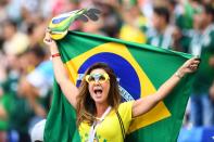 <p>A Brazil’s fan cheers prior to the Russia 2018 World Cup round of 16 football match between Brazil and Mexico at the Samara Arena in Samara on July 2, 2018. (Photo by MANAN VATSYAYANA / AFP) </p>