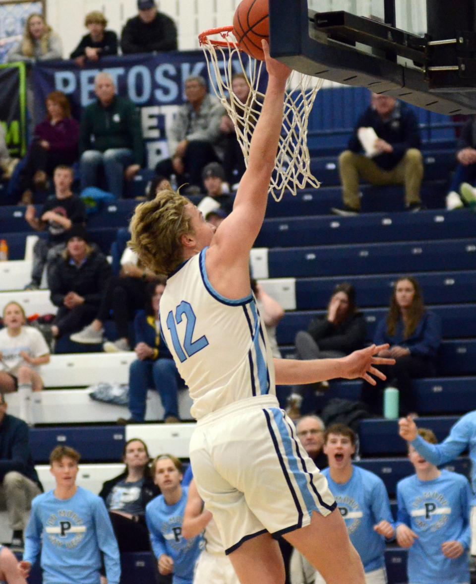 Petoskey senior Michael Squires finishes off a turnover with points at the other end.