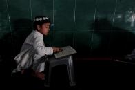 <p>A boy learns to read the Quran at a mosque during the holy month of Ramadan, in Islamabad, Pakistan, May 29, 2017. (Faisal Mahmood/Reuters) </p>