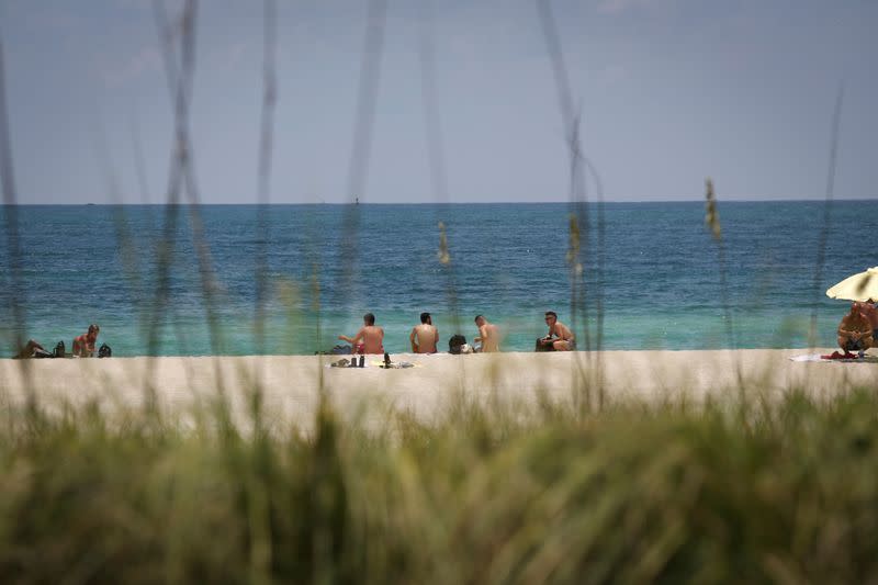 FILE PHOTO: Beaches reopen with restrictions to limit the spread of the coronavirus disease in MIami Beach