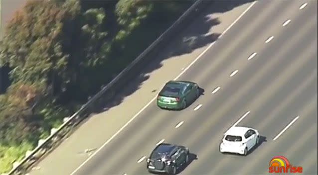 The green Holden Commodore almost lost control a number of times during the high-speed chase. Picture: 7 News