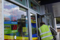 A customer enters a Plaid Pantry convenience store on Tuesday, April 9, 2024, in Portland, Ore. (AP Photo/Jenny Kane)