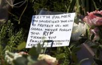 Tributes are seen following a recent attack in Westminster, London, Britain March 24, 2017. REUTERS/Neil Hall