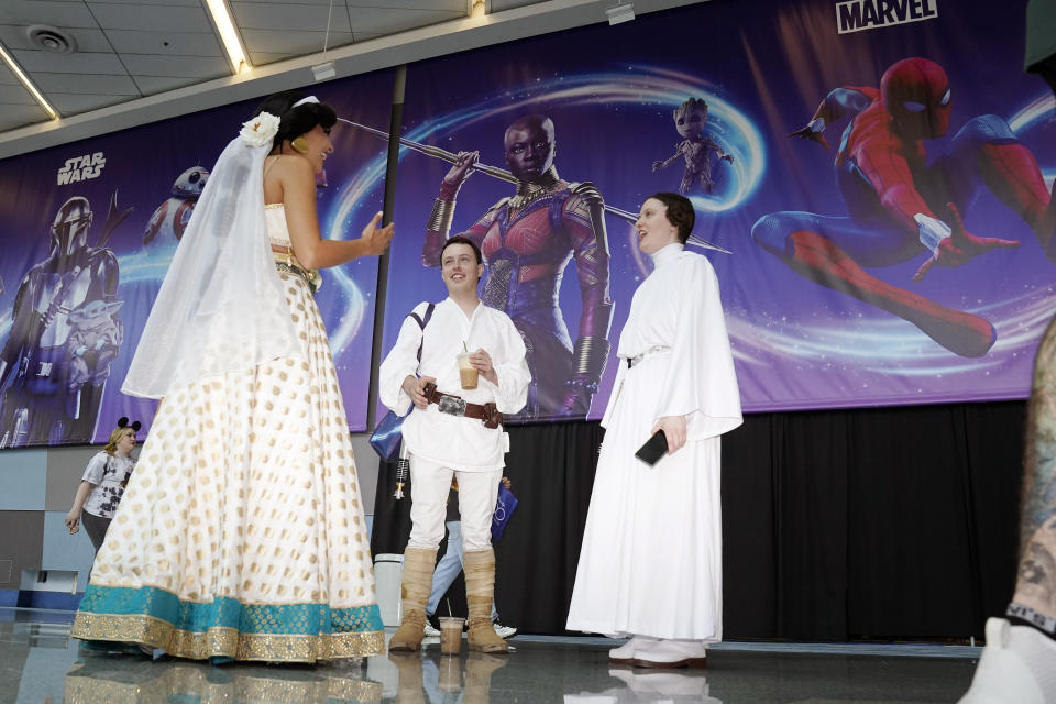 Cosplayers chat at the D23 Expo Saturday, Sept. 10, 2022, in Anaheim, Calif. (AP Photo/Mark J. Terrill)