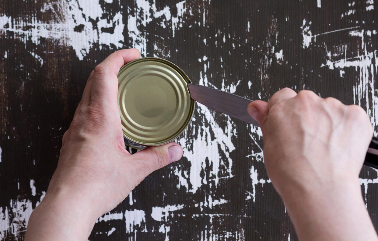 Yes, you can open a can without a can opener — you just have to be extremely careful. (Tatiana Foxy / Getty Images/iStockphoto)