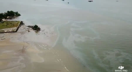 The extent of an oil spill seen at Balikpapan Bay, East Kalimantan, Indonesia in this still image taken from an April 4, 2018 drone video obtained from social media. Imeida Tandrin/via REUTERS