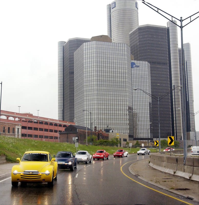 General Motors Chairman Rick Wagoner leads a parade of 70 Chevrolet SSR vehicles from GM headquarters at Detroit's Renaissance Center on August 20, 2004. On December 18, 1991, the company announced it would close 21 plants and eliminate 74,000 jobs in four years to offset record losses. File Photo by Joe Polimeni/UPI