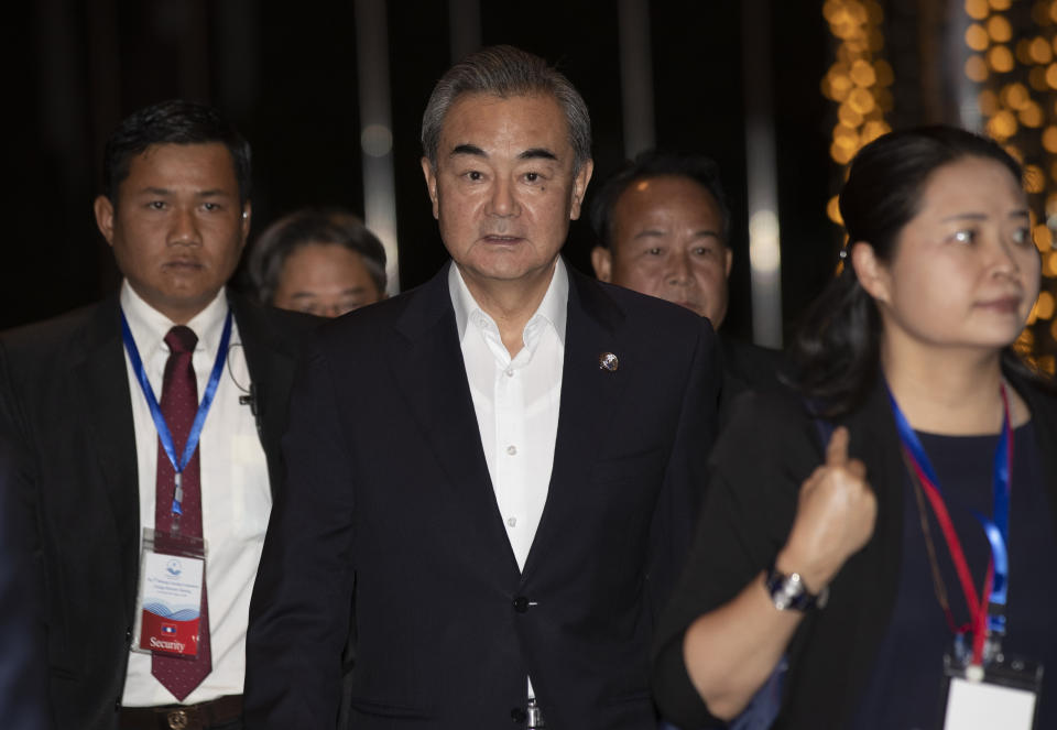 China's Foreign Minister Wang Yi arrives for welcome dinner in Vientiane, Laos, Wednesday, Feb. 19, 2020. The foreign ministers of the Association of Southeast Asian Nations are meeting in Laos Thursday to discuss ways to curb the spread of the new virus infections. (AP Photo/Sakchai Lalit)